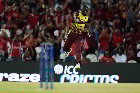 Rovman Powell celebrates after taking a catch